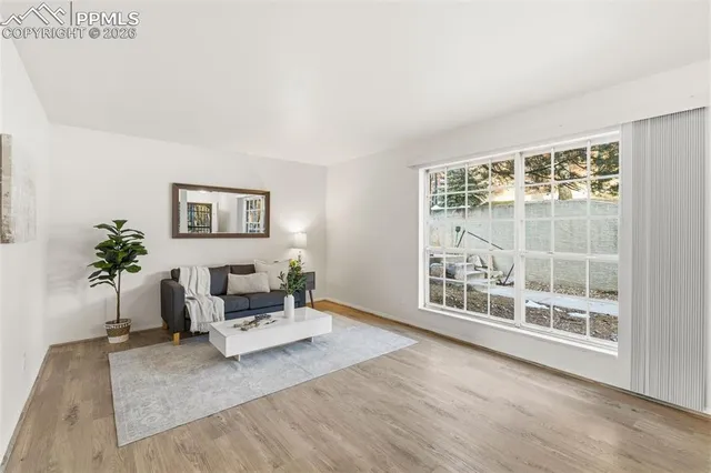 a living room with furniture and a table