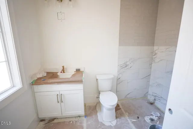 an empty room with a empty space and windows