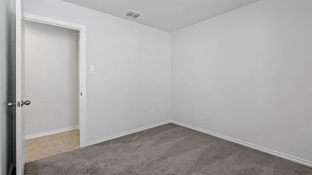 a bathroom with a granite countertop toilet and a shower