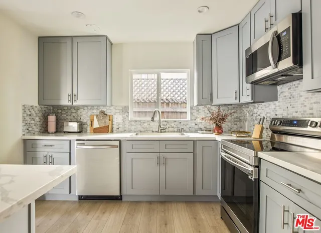 a spacious bathroom with a double vanity sink toilet and shower