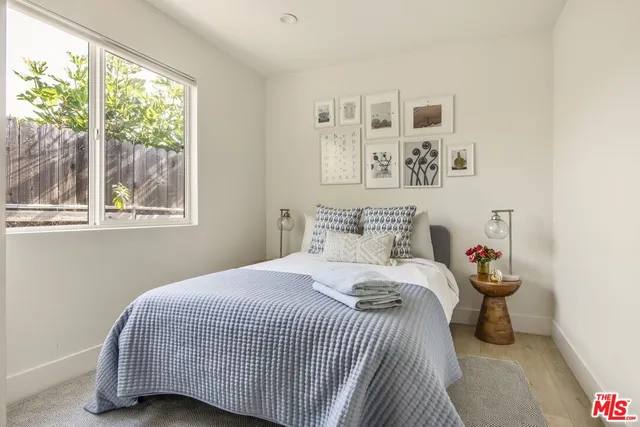 a bathroom with a shower a sink and a mirror