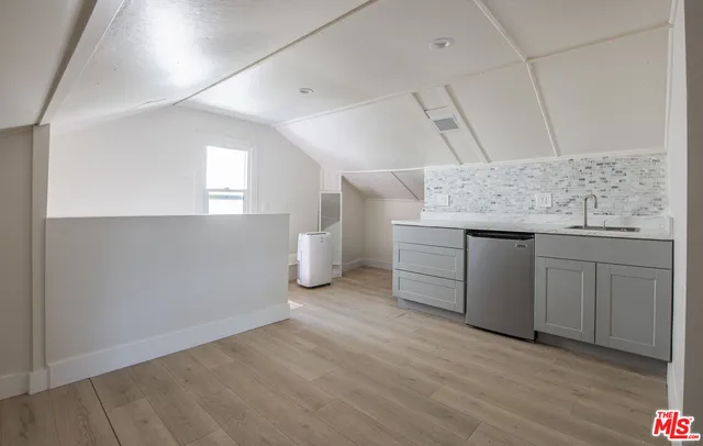 a view of a storage & utility room with wooden floor