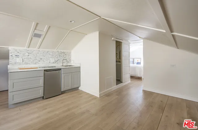 a view of cabinets and wooden floor