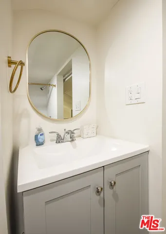 a bedroom with a large bed and a large window