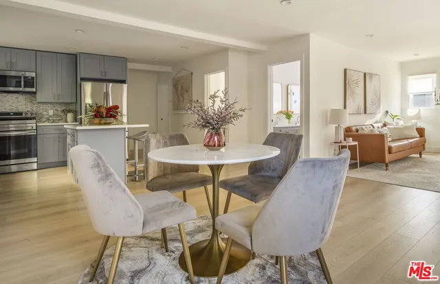 a view of a dining room with furniture window and outside view