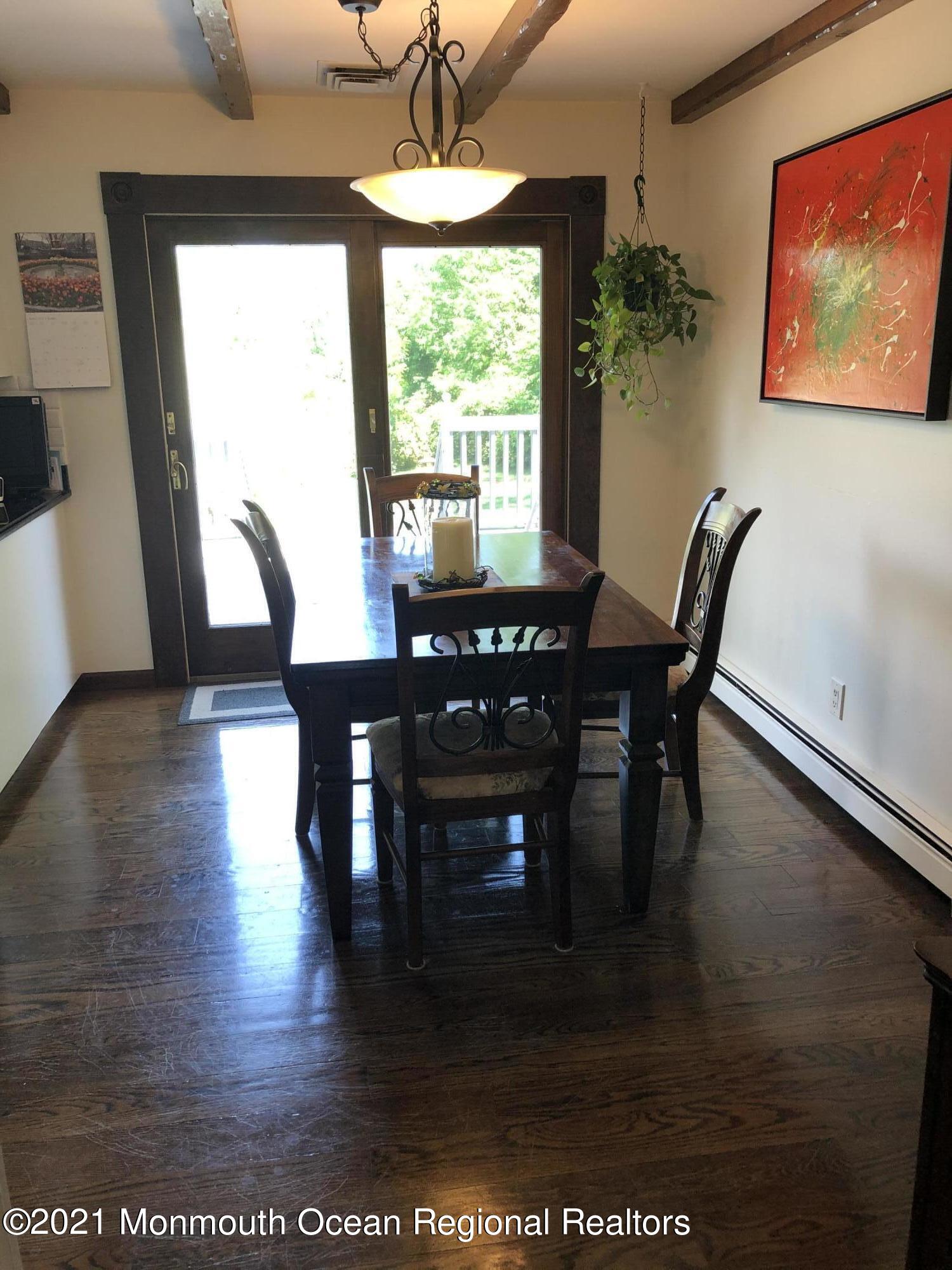 2 Hunt Road Freehold, NJ 07728 - Photo 14 of 35 a view of a dining room with furniture window and wooden floor