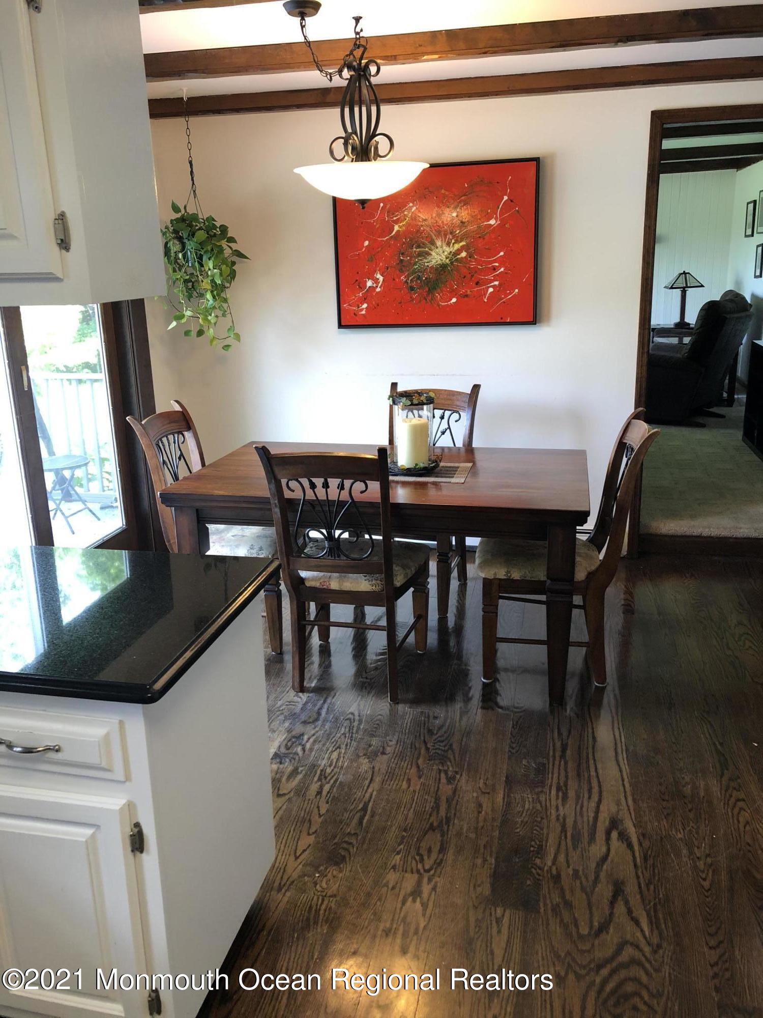 2 Hunt Road Freehold, NJ 07728 - Photo 19 of 35 a view of a dining room with furniture and wooden floor