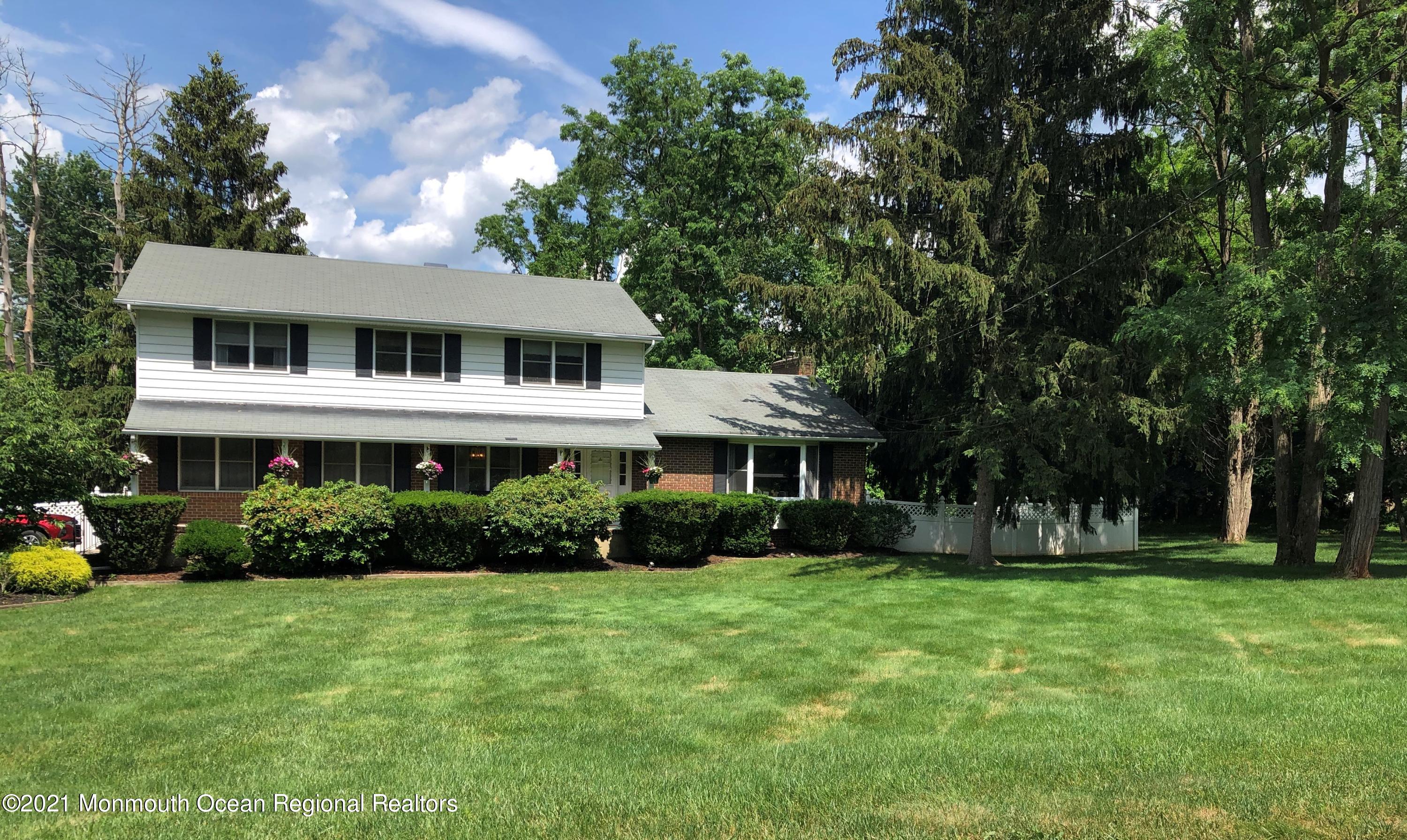 2 Hunt Road Freehold, NJ 07728 - Photo 7 of 35 a front view of a house with garden