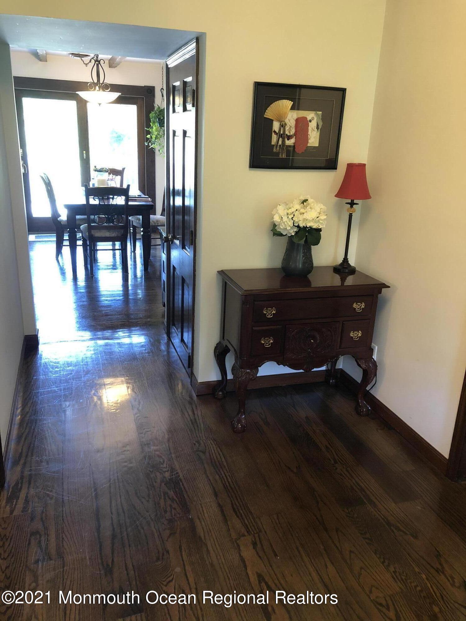 2 Hunt Road Freehold, NJ 07728 - Photo 9 of 35 a view of a room with furniture and wooden floor
