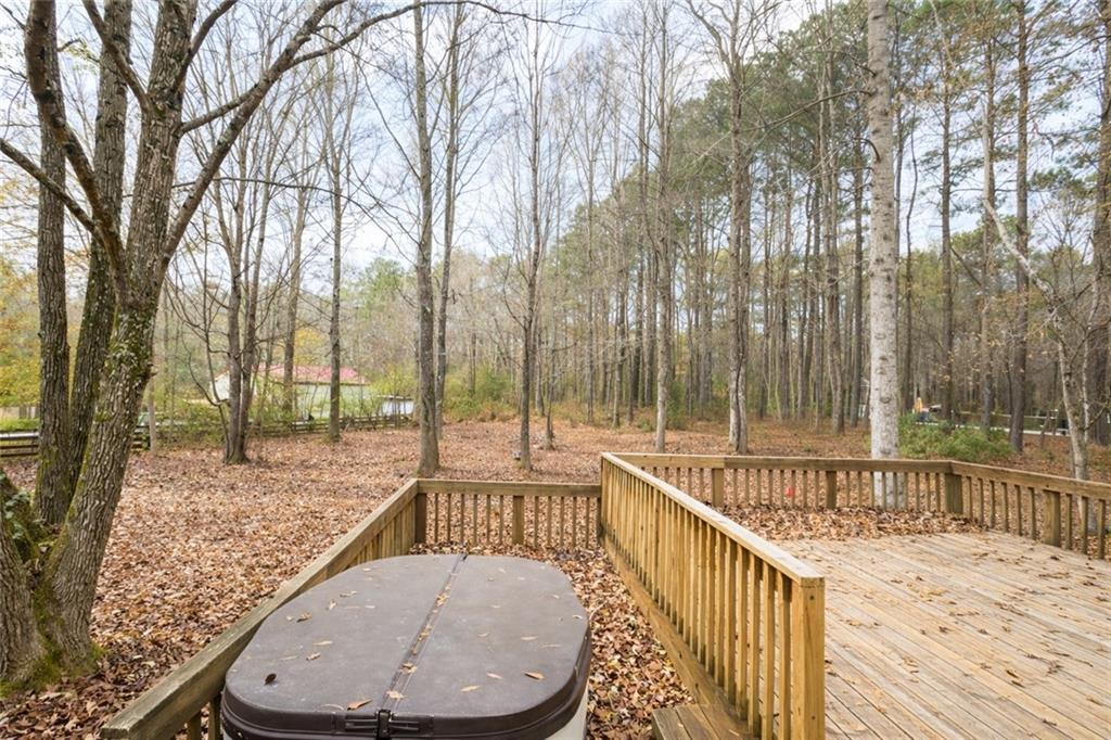 265 Winding Stream Trail Hampton, GA 30228 - Photo 27 of 29 a view of a balcony with wooden fence