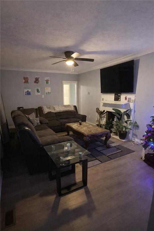 265 Winding Stream Trail Hampton, GA 30228 - Photo 5 of 29 a living room with furniture and a flat screen tv