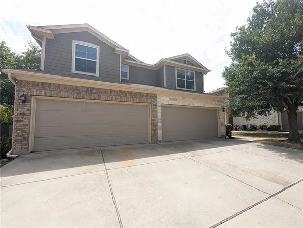 a view of a house with a garage