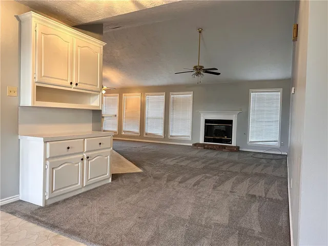 a view of a kitchen with sink and cabinet
