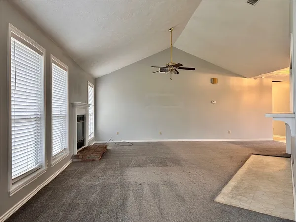 a view of an empty room with a window