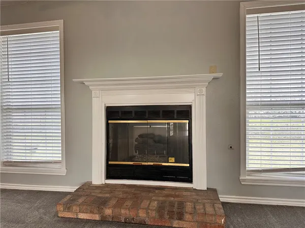 a living room with a fireplace