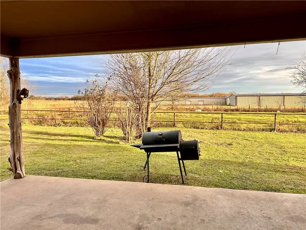 a view of yard and swimming pool