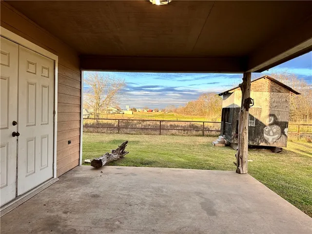 a view of yard and swimming pool