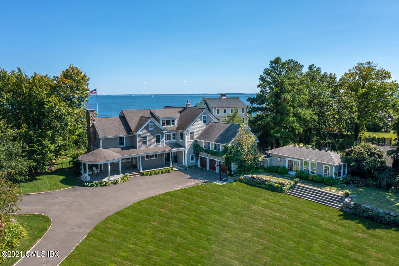 an aerial view of a house with swimming pool garden view and a yard