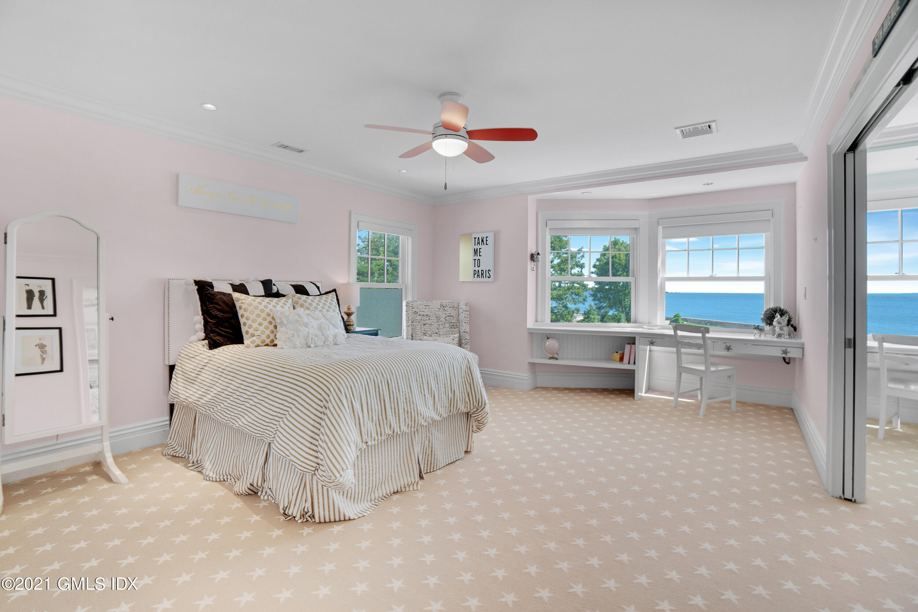 20 Ballwood Road Old Greenwich, CT 06870 - Photo 16 of 32 a bedroom with a large bed and a chandelier fan