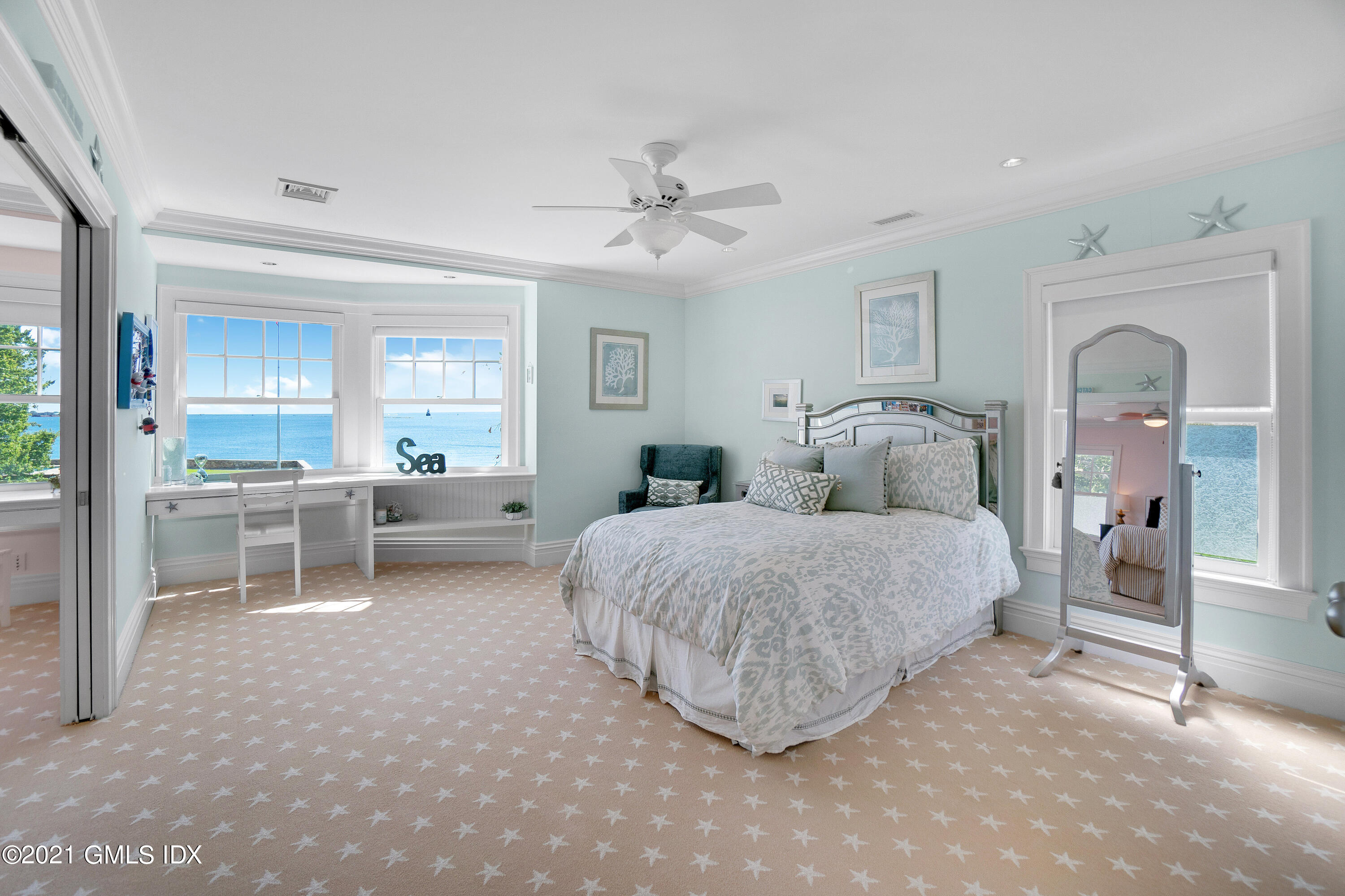 20 Ballwood Road Old Greenwich, CT 06870 - Photo 17 of 32 a bedroom with a bed and a view of en suite bathroom