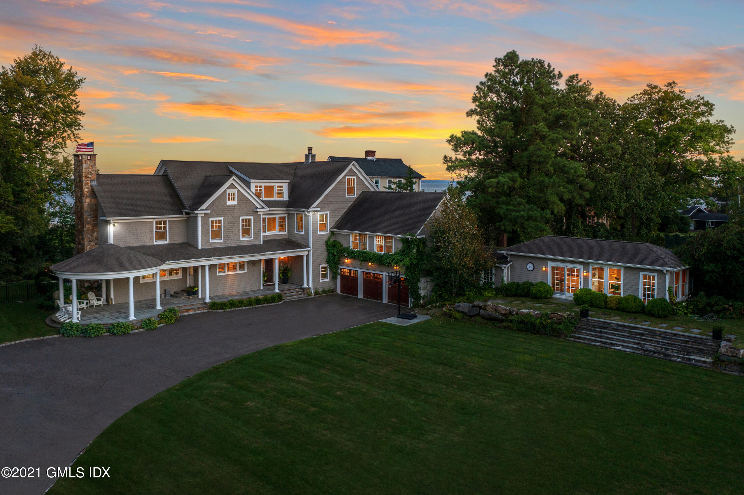 20 Ballwood Road Old Greenwich, CT 06870 - Photo 32 of 32 a front view of a house with a garden
