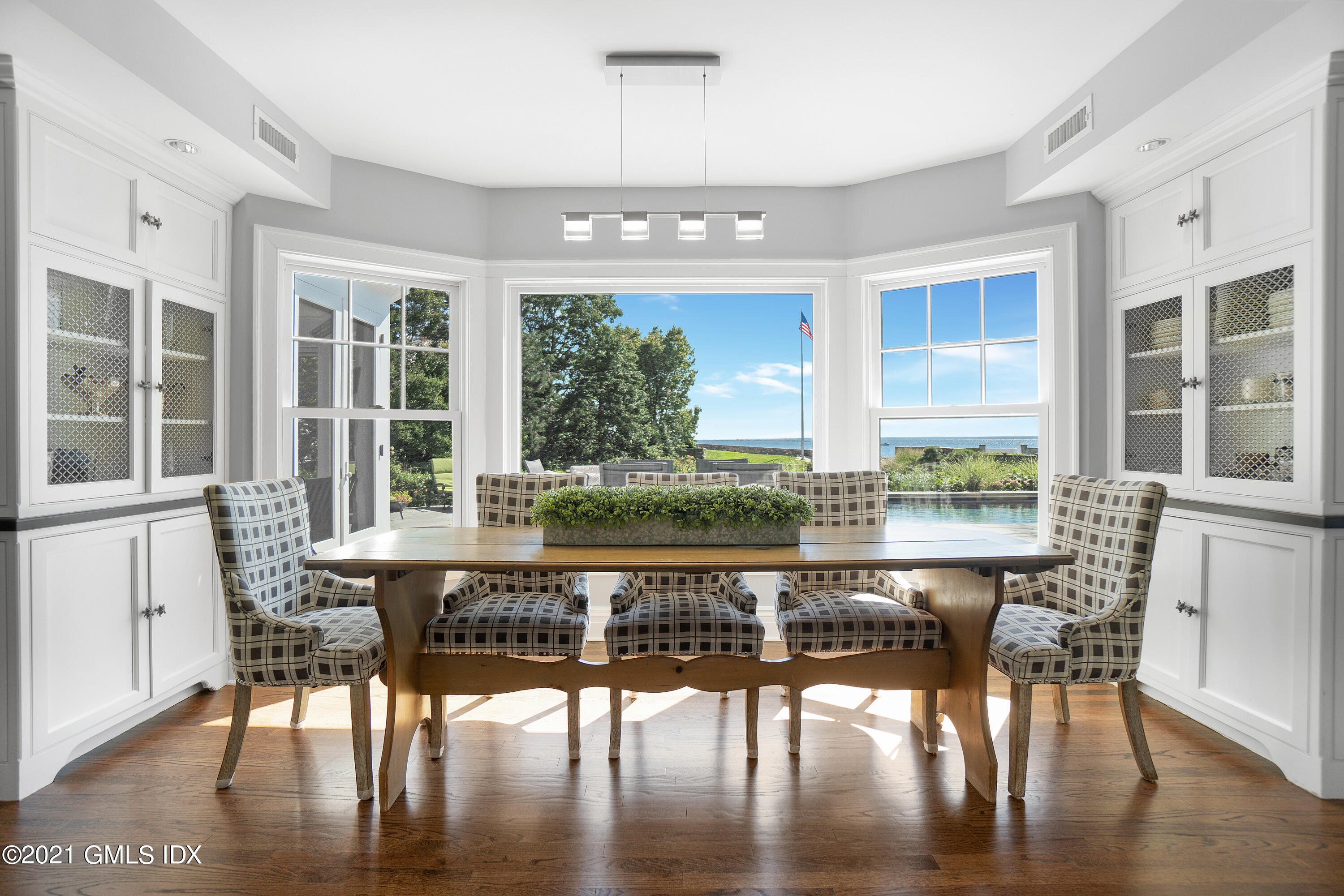 20 Ballwood Road Old Greenwich, CT 06870 - Photo 9 of 32 a view of a dining room with furniture window and wooden floor
