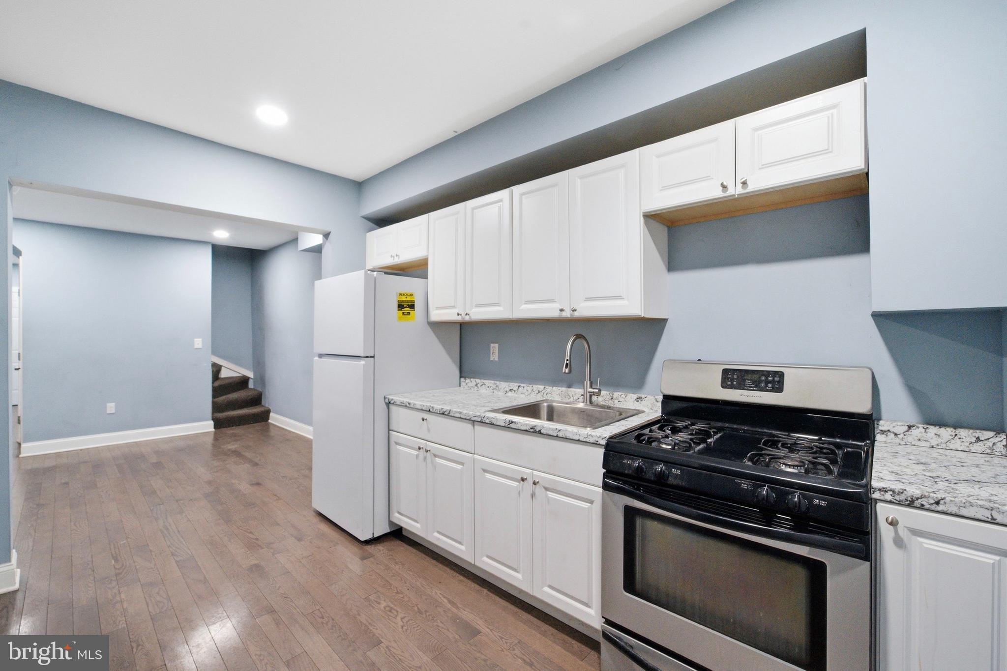 a kitchen with a stove and a sink