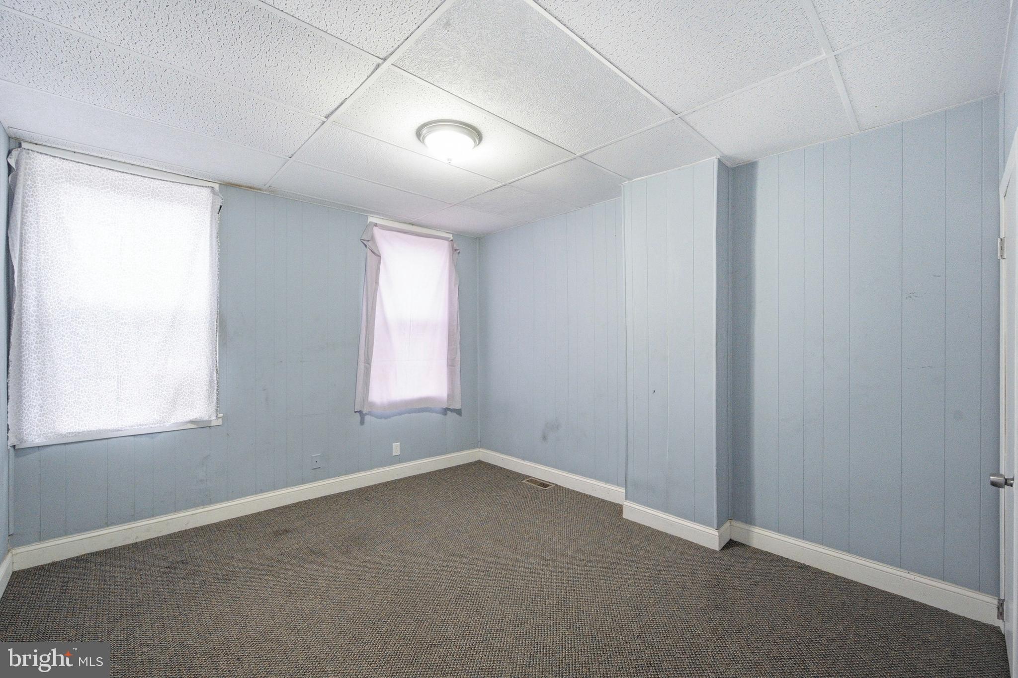 215 South Calhoun Street Baltimore, MD 21223 - Photo 12 of 15 an empty room with a window