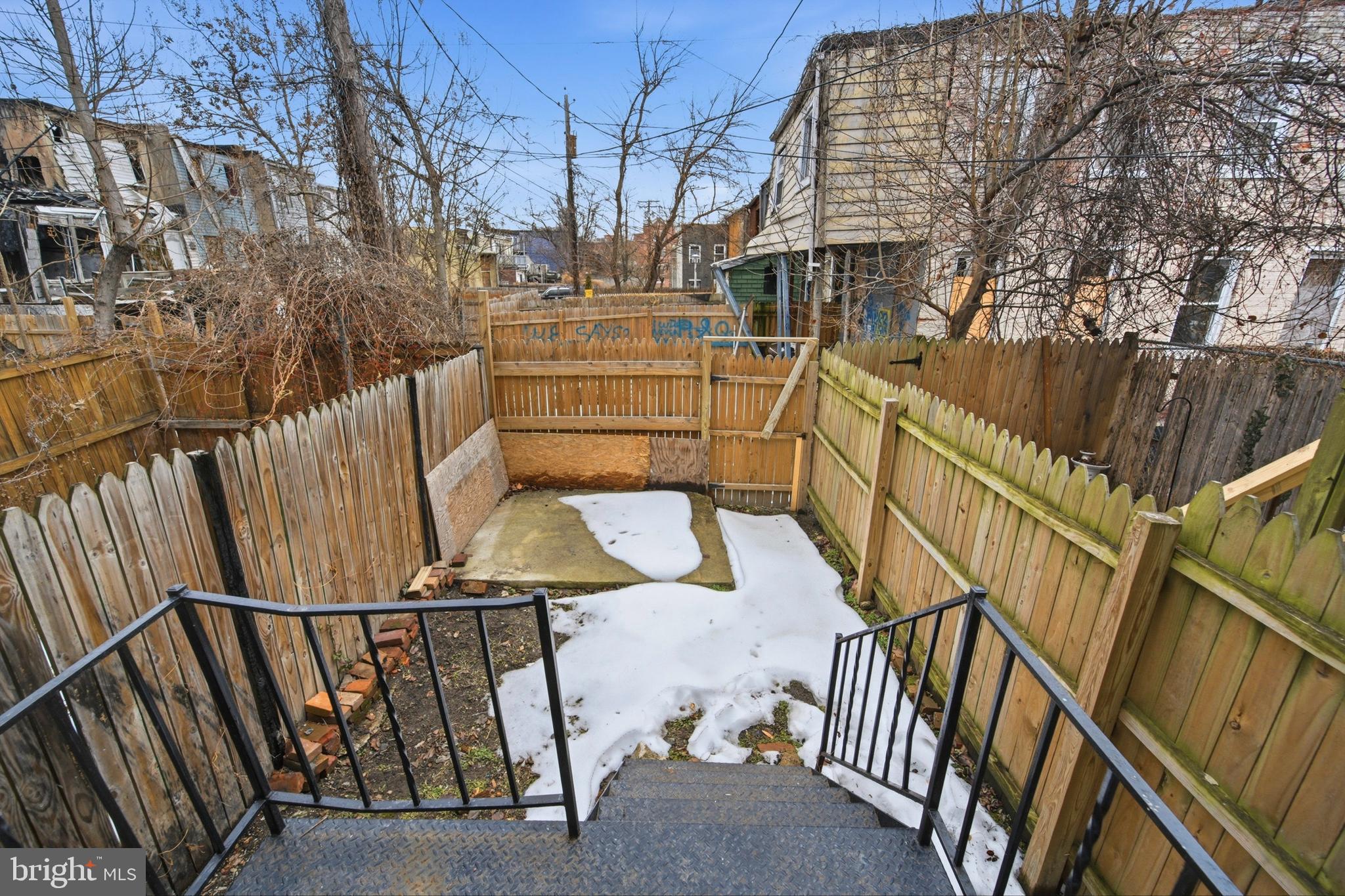 215 South Calhoun Street Baltimore, MD 21223 - Photo 13 of 15 a view of entryway with wooden floor and stairs