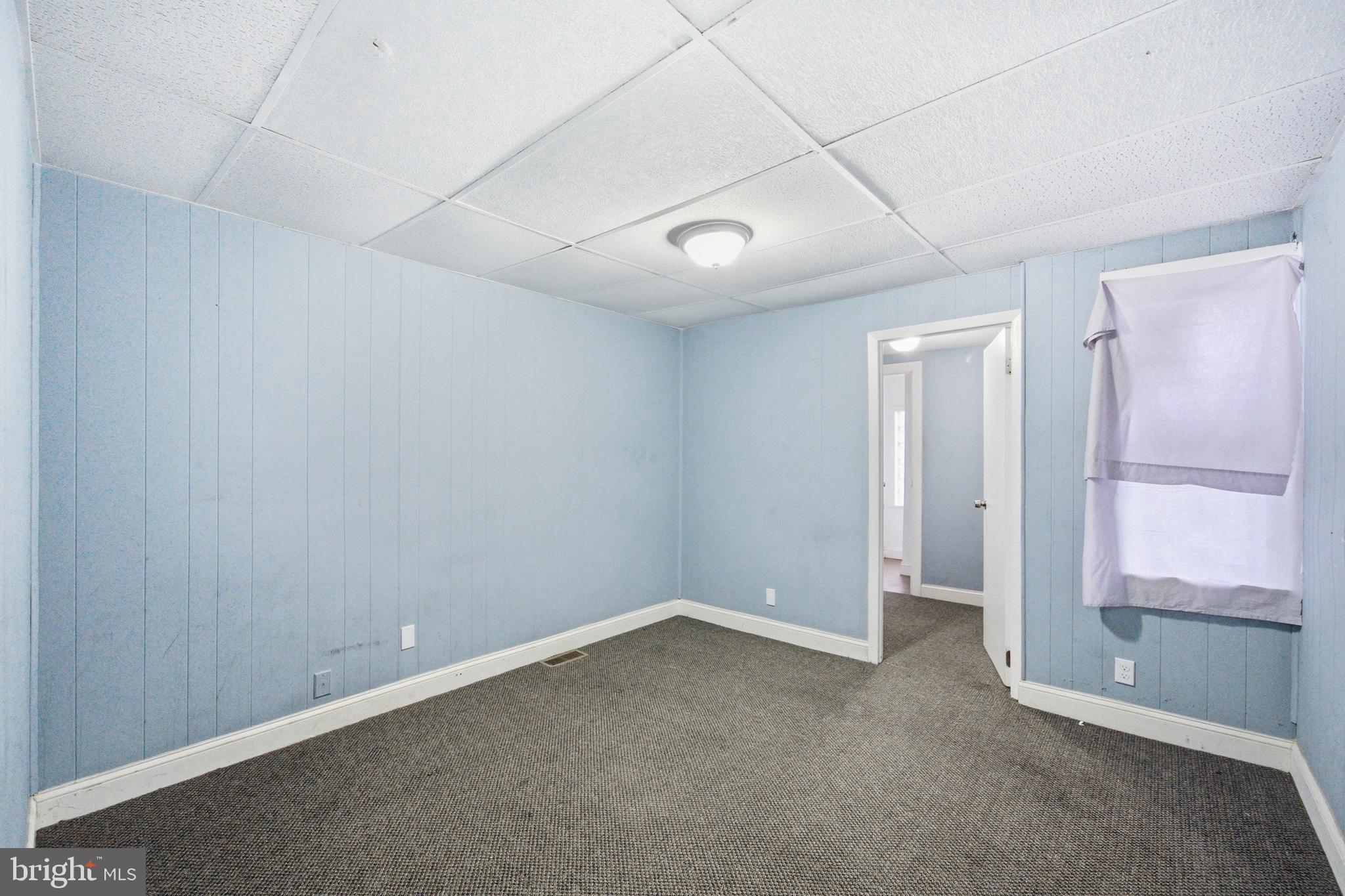 215 South Calhoun Street Baltimore, MD 21223 - Photo 8 of 15 wooden floor in an empty room