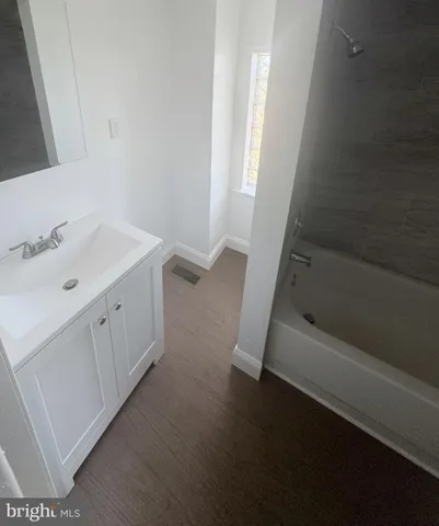 a bathroom with a sink and a bathtub