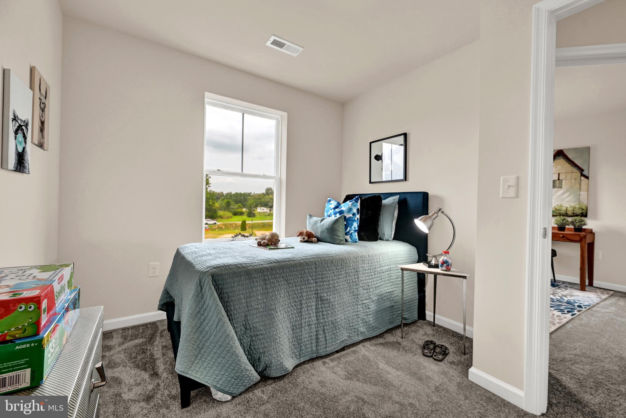 1 Landing Place, Unit 1 York, PA 17408 - Photo 23 of 35 a bedroom with a bed and a window