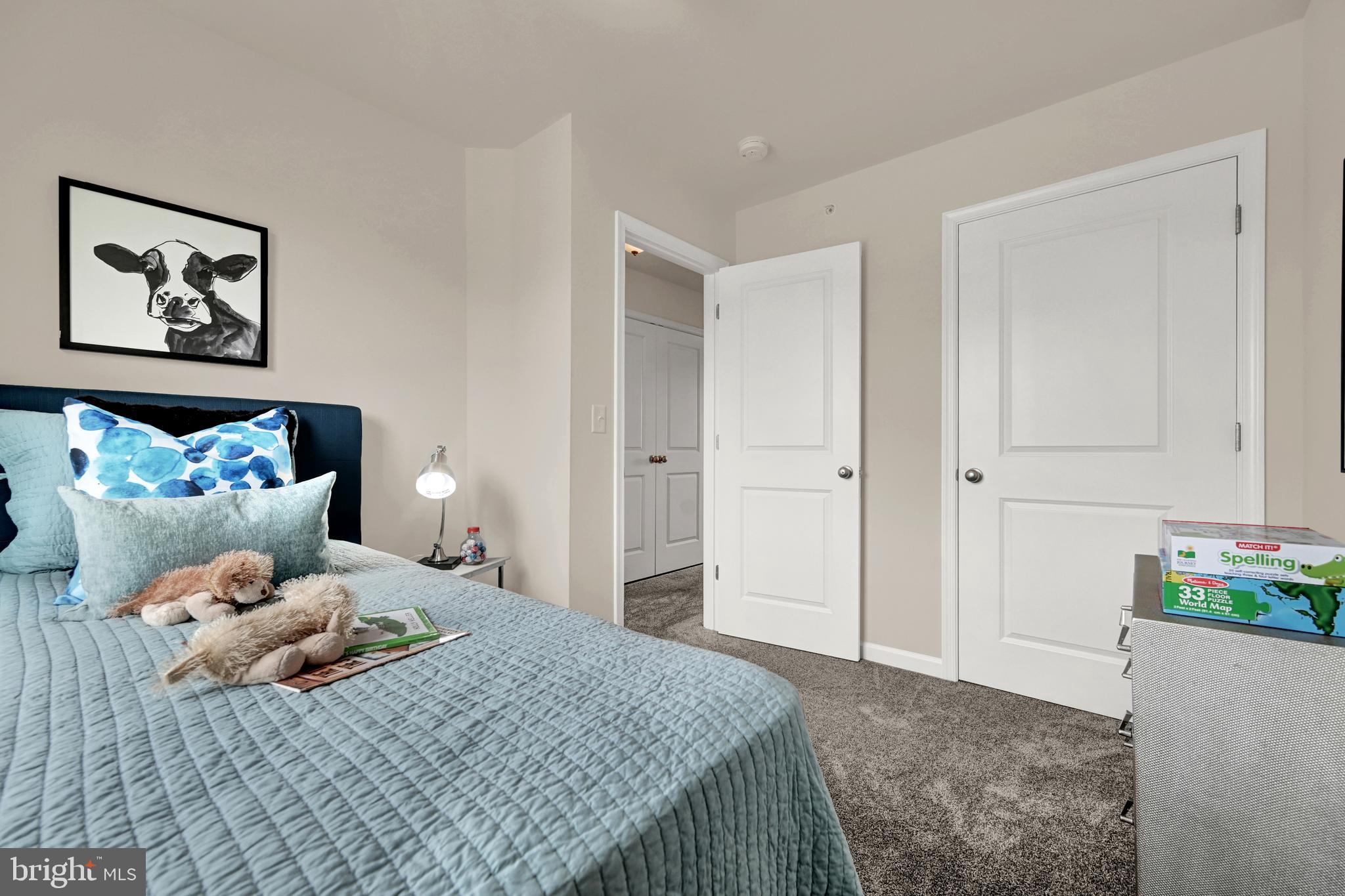 1 Landing Place, Unit 1 York, PA 17408 - Photo 24 of 35 a bedroom with a bed and a painting on the wall