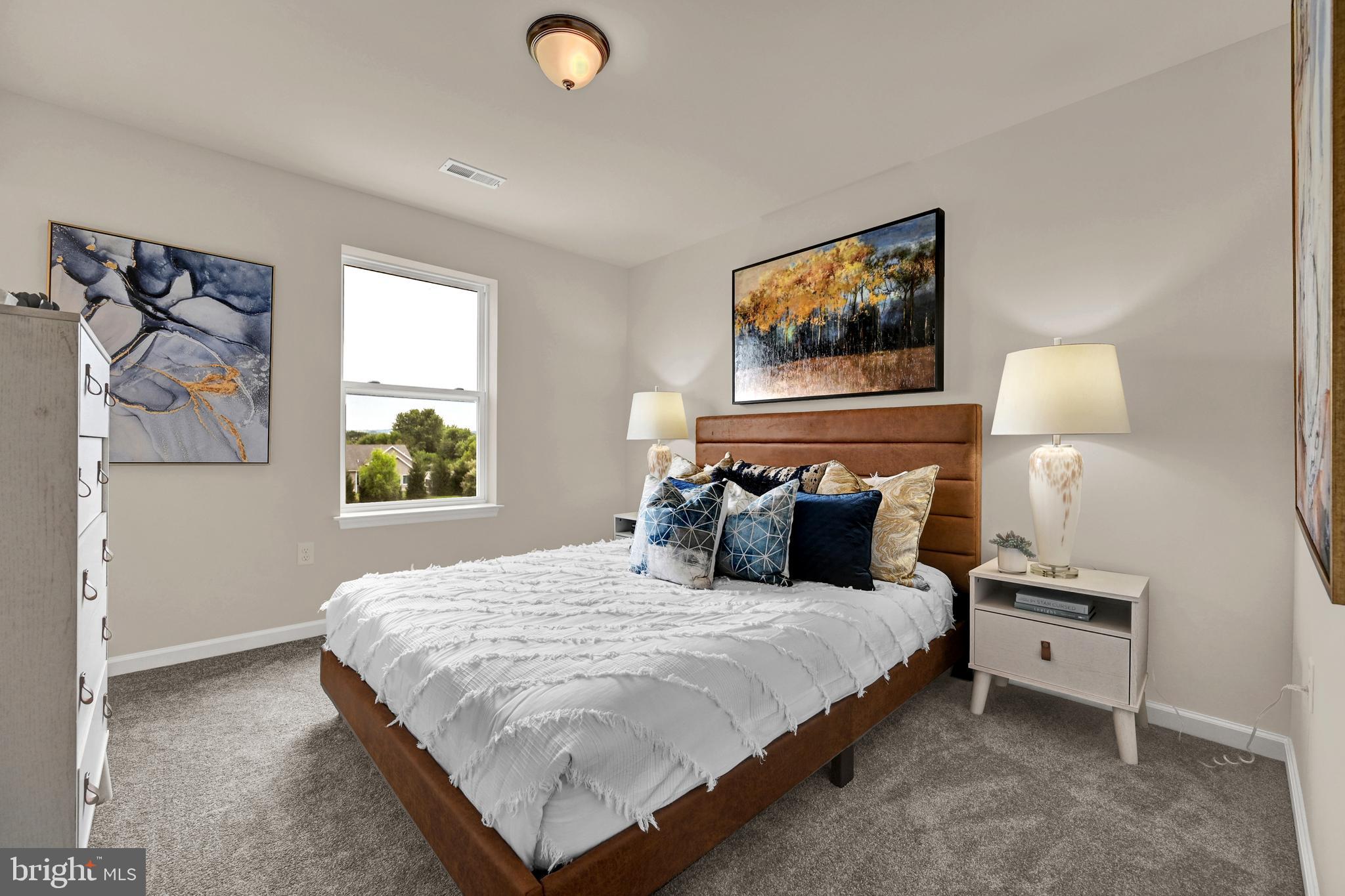 1 Landing Place, Unit 1 York, PA 17408 - Photo 27 of 35 a bedroom with a bed and a painting on the wall