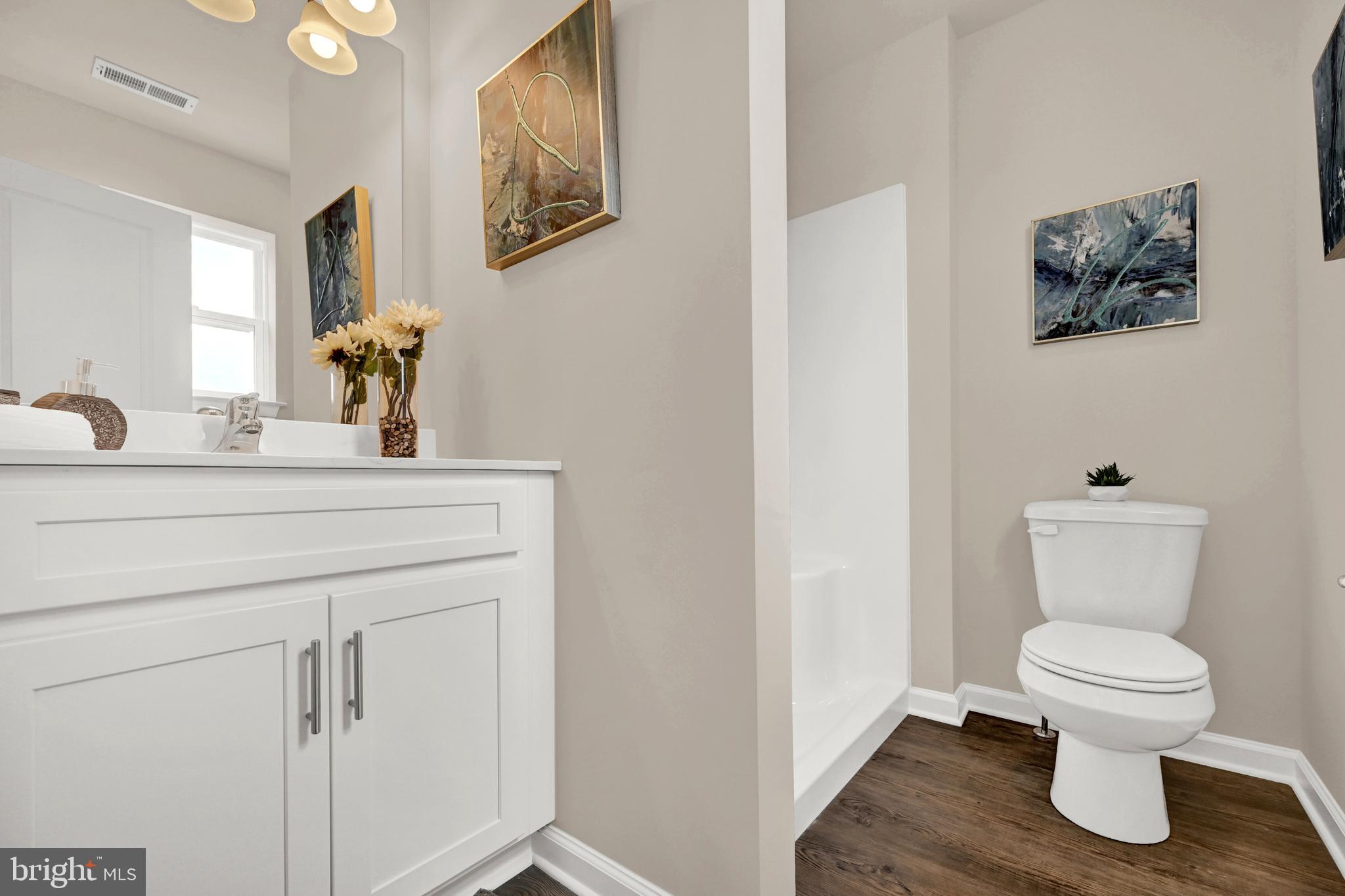 1 Landing Place, Unit 1 York, PA 17408 - Photo 9 of 35 a bathroom with a toilet sink and mirror