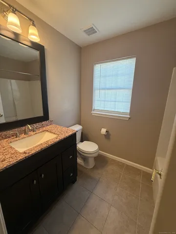 an empty room with a fireplace