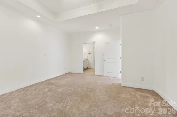 a spacious bathroom with a double vanity sink a mirror and shower