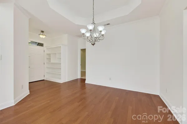 a view of a chandelier in an empty room
