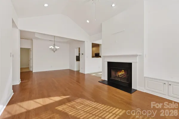 a view of an empty room with a fireplace
