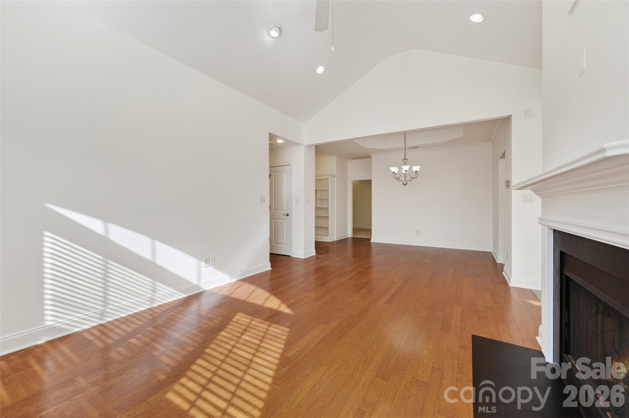 2803 Bellasera Way Matthews, NC 28105 - Photo 10 of 27 a view of an empty room and a kitchen