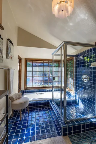 a living room with a large window and furniture