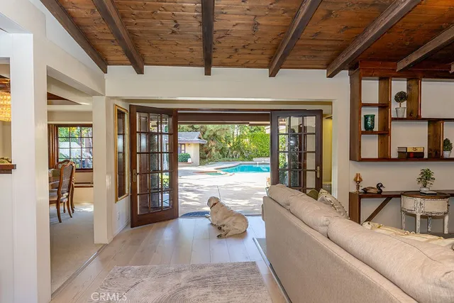 swimming pool view with a seating space