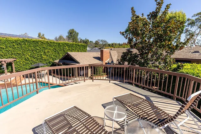 a view of a house with potted plants