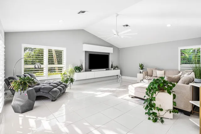 a view of an house with backyard space and swimming pool