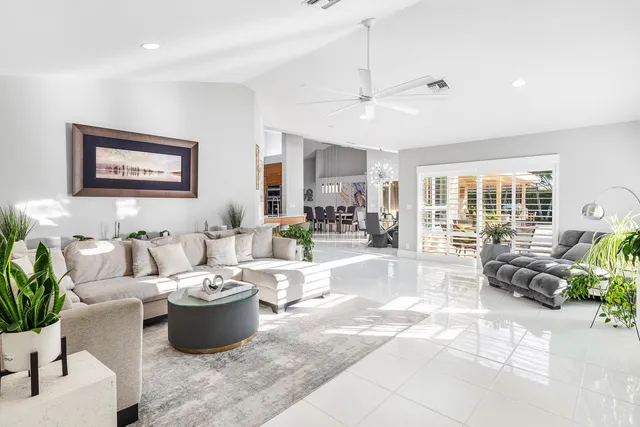 a view of a house with backyard and a tree