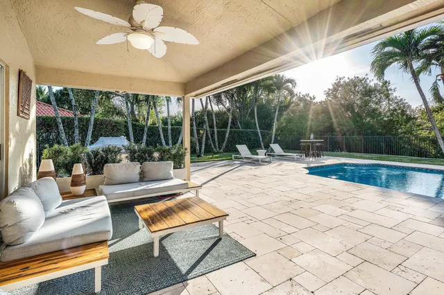 a spacious bedroom with a bed and a flat screen tv