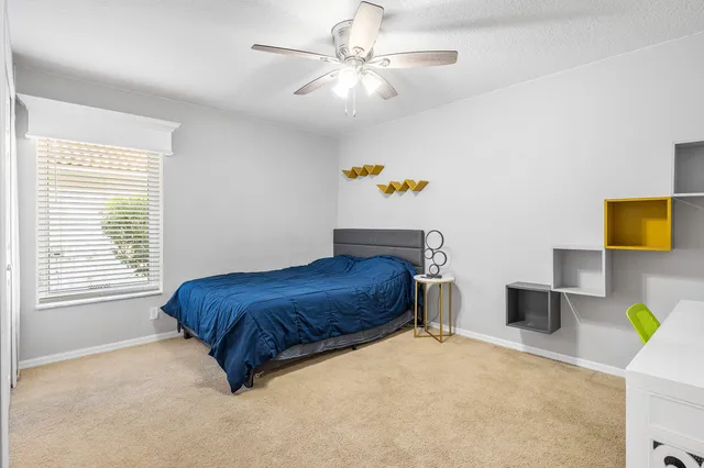 an aerial view of residential houses with outdoor space and swimming pool