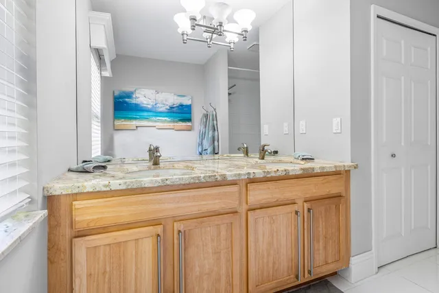 an aerial view of residential houses with outdoor space and swimming pool