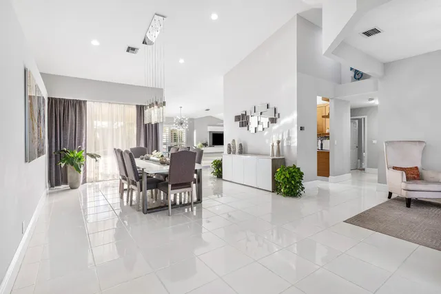 a kitchen with a stove and white cabinets