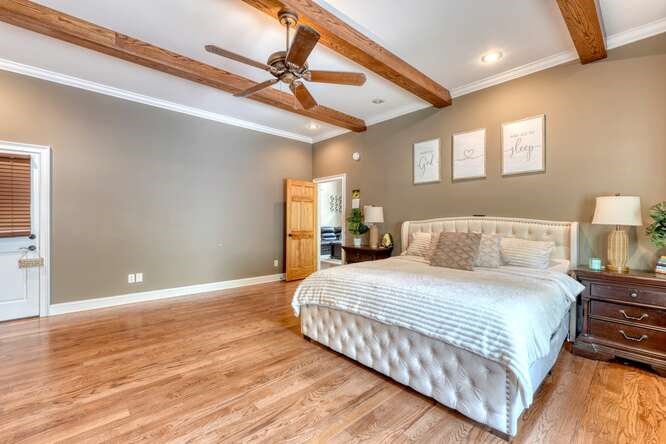 115 Dawsons Lane Murphy, NC 28906 - Photo 22 of 93 a bedroom with a large bed and a ceiling fan